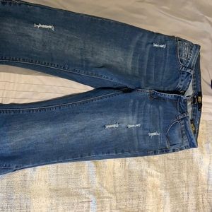 Darker blue Mid Rise Flare Jeans.